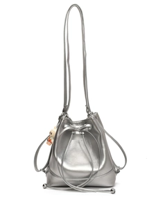 Silver metallic drawstring bucket backpack with bow detail and rabbit charm on white background