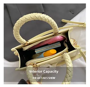 Internal view of cream PU leather handbag showing storage space for mobile phone and makeup