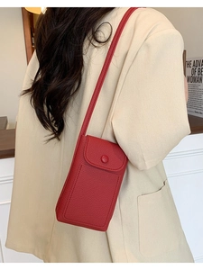 Elegant red leather crossbody phone bag with pebble texture and adjustable shoulder strap