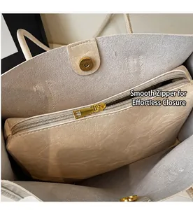 Detail of soft cream PU leather tote bag with smooth gold zipper and magnetic closure