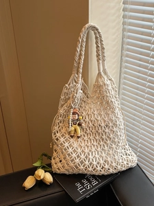 Chic hollow knit tote bag in cream white with cartoon pendant and pearl decor