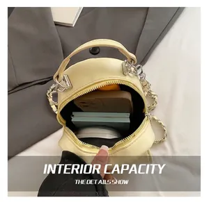 Top-down view of the compact interior storage space of this beige quilted mini bag