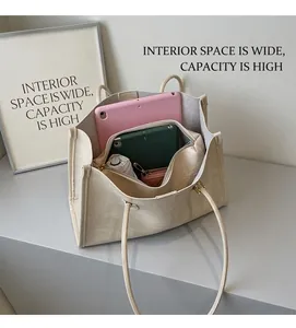 Interior view of large capacity beige PU leather tote bag showing spacious compartments