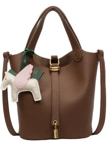 Dark brown pebbled leather bucket bag with gold hardware and colorful pegasus charm