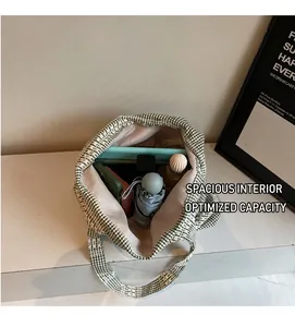 Spacious interior of a green checkered canvas tote bag with daily essentials inside