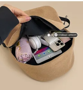Detail showing the large interior capacity of the khaki mesh bag for daily essentials