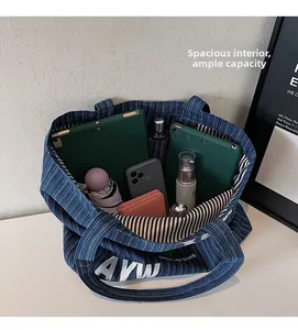 Detail view of large capacity striped denim tote bag showing interior storage space