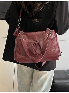 Classic dark burgundy faux leather tote bag with drawstring detail and adjustable strap