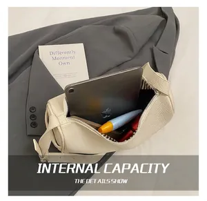 Internal capacity of off-white lychee leather barrel bag showing storage space