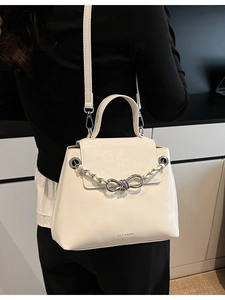 Minimalist cream white crossbody bag with braided chain and bow metal accent decoration