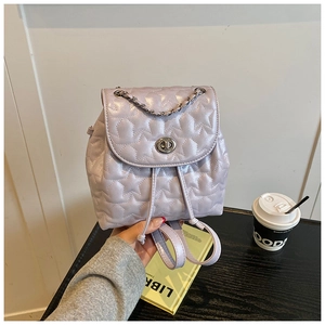 Detail view of lavender mini backpack with star quilting and silver twist lock