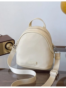 Fashionable beige small shell backpack for women with adjustable straps and PU leather finish