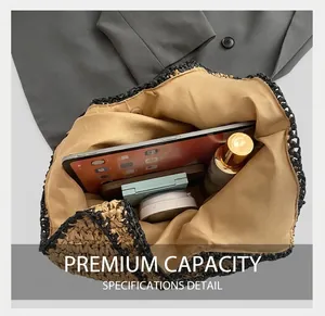Internal view of straw woven bag showing spacious capacity and magnetic buckle