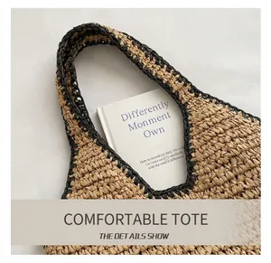 Detail shot of the woven handle showing texture and mixed natural fibers of the tote bag