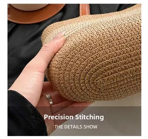 Detailed close-up of woven straw handbag featuring precise stitching and brown leather handle