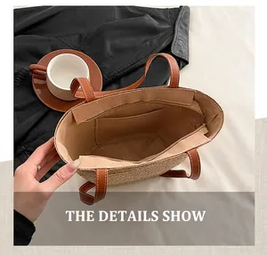 Detail showing the large interior capacity and zipper closure of the straw bucket bag