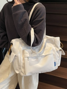 White nylon large capacity tote bag with yellow drawstring pockets for commuting