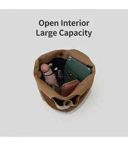 Top view of spacious khaki canvas tote bag interior showing daily essentials storage