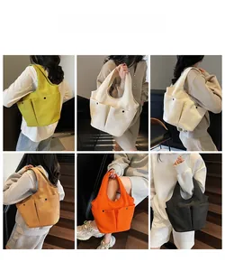 Multiple views of pleated canvas tote bags in various colors on models for daily commute