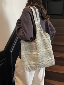 Green and white checkered canvas tote bag with decorative wave jacquard on shoulder strap