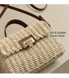Detailed view of woven straw crossbody bag with brown leather trim and gold twist lock