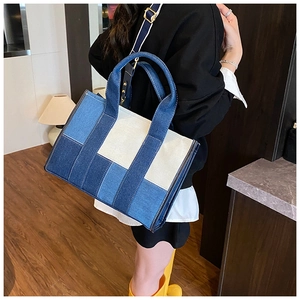 Detail view of large capacity patchwork denim tote bag with adjustable shoulder strap