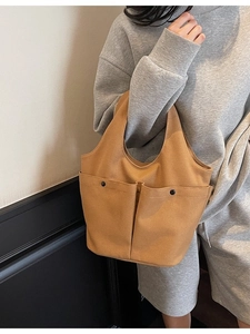 Large camel canvas tote bag with double front pockets for daily commute and leisure wear