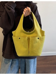 Large yellow pleated tote bag with double pockets and magnetic closure for daily commuting