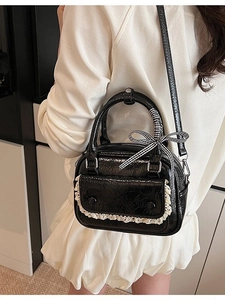Elegant black patent leather handbag with lace trim and bow ribbon for women
