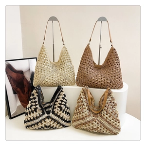 Detailed macro view of hollow-out crochet pattern and premium leather straps on woven tote bags