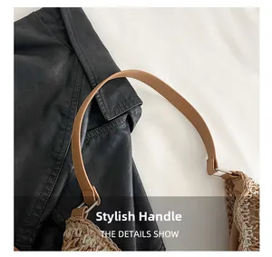 Detail of woven tote bag with a brown leather handle and silver metal ring connector