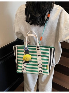 Green striped canvas tote bag with a yellow smiley charm and large capacity for women