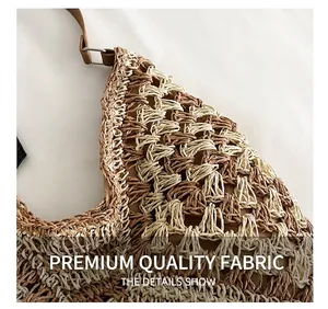 Detail of woven tote bag showing beige mesh texture and leather strap with D-ring