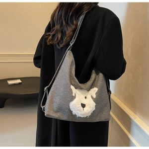 Gray knitted tote bag featuring a cute 3D fuzzy Schnauzer dog pattern shown on shoulder
