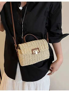 Vintage woven straw handbag with brown leather handles and adjustable shoulder strap crossbody