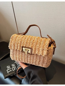Vintage woven straw handbag with brown leather trim and gold twist-lock closure