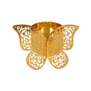 Détail d'un rond de serviette papillon doré ajouré avec motifs d'ailes gravés au laser