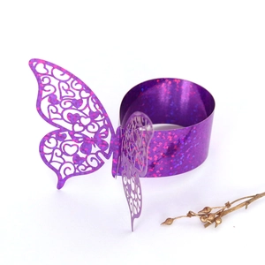 Detail of purple hollow butterfly napkin ring with glitter laser cut patterns
