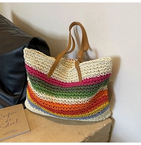 Macro shot of colorful woven raffia texture and premium faux leather shoulder straps