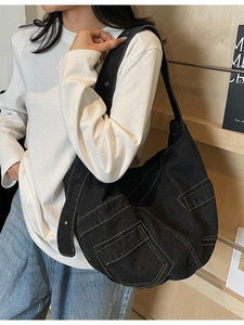 Large black washed denim crossbody bag with contrast stitching and side pockets