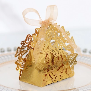 Laser cut hollow butterfly favor box in gold glitter finish with satin ribbon bow