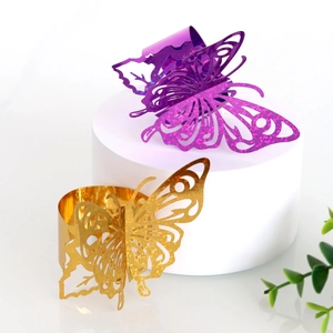 Detailed laser-cut butterfly napkin ring in metallic purple and gold with glitter texture