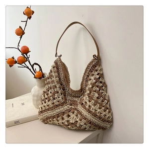 Detail of hand-woven geometric hollow pattern on a summer crochet tote bag