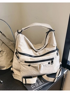 Versatile beige large capacity nylon tote bag with functional multi-pockets and black straps
