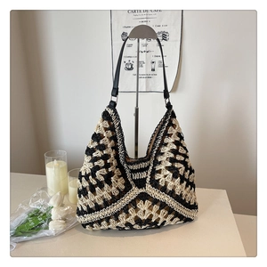 Detailed view of woven tote bag with geometric hollow patterns and leather straps