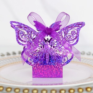 Close-up of laser-cut purple butterfly candy box with glitter finish and ribbon bow