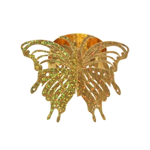 Detailed view of golden laser-cut butterfly napkin ring with sparkling glitter finish