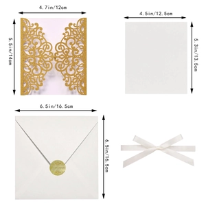 Golden glitter laser-cut invitation set with white ribbon bow and envelopes for weddings