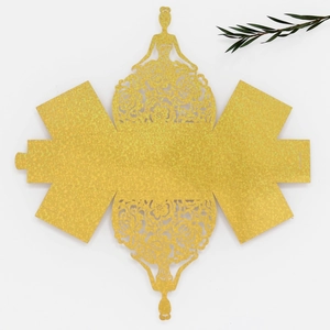 Flat lay of laser-cut yellow princess gift box template with intricate floral hollows