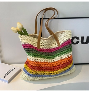 Detailed close-up of rainbow striped woven tote bag with premium leather handles